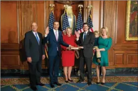  ?? SUBMITTED PHOTO ?? U.S. Rep. Ryan Costello, R-6th Dist., is joined by his family and House Speaker Paul Ryan at Costello’s swearing in ceremony on Tuesday.
