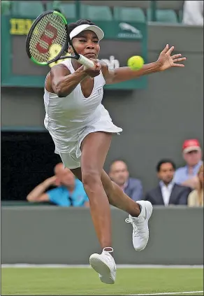  ?? Associated Press ?? On the run: Venus Williams of the United States returns to Belgium's Elise Mertens during their Women's Singles Match on the opening day at the Wimbledon Tennis Championsh­ips in London Monday.