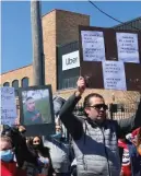  ?? ZINYA SALFITI/SUN-TIMES ?? Ride-hailing drivers gathered Friday to call on Uber, Lyft and other ride-hailing companies to do more to protect them.