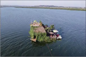  ?? PATRICK ONEN — THE ASSOCIATED PRESS ?? A floating restaurant and bar is seen from the air in Lake Victoria Feb. 18 near the Luzira area of Kampala, Uganda.