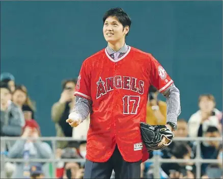  ?? Masanori Takei Associated Press ?? REFERRED TO as the “Babe Ruth of Japan,” Shohei Ohtani is trying to do what Ruth stopped doing 98 years ago when the New York Yankees told him to give up pitching and keep hitting because the Angels plan to let the rookie pitch and hit.