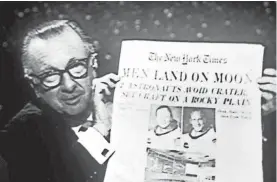  ?? WHITEHURST PHOTOS ?? On July 21, 1969, the day after Neil Armstrong and Buzz Aldrin walked on the moon, Cronkite held up The New York Times on the air.