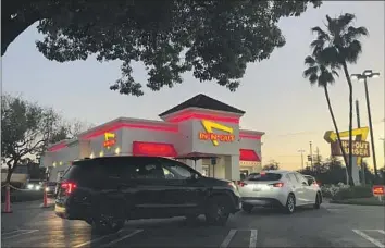  ?? Carolina A. Miranda Los Angeles Times ?? THE IN-N-OUT Burger in Alhambra. One of the chain’s restaurant­s in San Francisco made national headlines this month for refusing to enforce COVID-19 vaccinatio­n checks on customers.
