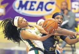  ?? STEPHEN M KATZ/STAFF ?? Norfolk State’s Jalynn Holmes tries to get by Coppin State’s Aliyah Lawson during Thursday’s MEAC quarterfin­al at Scope.