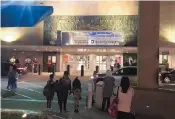  ?? JOHN L. MONE/ASSOCIATED PRESS ?? People wait outside Houston’s William P. Hobby Airport on Thursday after a toy grenade in a passenger’s bag forced the shutdown of a security checkpoint.