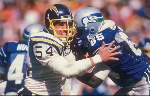  ?? (Los Angeles Chargers photo) ?? Billy Ray Smith Jr. (54) was a two-time consensus All-American as a defensive lineman while at Arkansas in 1979-82. He was the first defensive player taken in the NFL Draft when he was taken with the fifth pick by the San Diego Chargers, with whom he spent his entire 10-year NFL career.