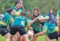  ??  ?? Ailsa MacLachlan charges her way through the Helensburg­h defence.