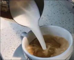  ??  ?? In this photo taken Friday a barista pours steamed milk in a coffee at a cafe in Los Angeles. AP PHOTO/ RICHARD VOGEL