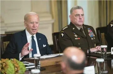  ?? DOUG MILLS/THE NEW YORK TIMES ?? President Joe Biden meets with military leaders, including Gen. Mark Milley, chair of the Joint Chiefs of Staff, right, on Oct. 26 in the State Dining Room of the White House in Washington.