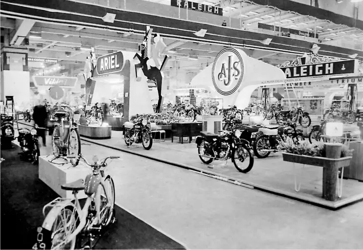  ??  ?? What a sight for sore eyes the Earls Court exhibition floor looked in 1954, with Ariel’s ‘dark horse’ absolutely unmissable. Pointing inwards at the bottom left, NSU’s 49cc, two-speed Quickly was to make a huge impact in the years to come.