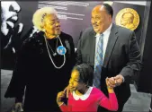  ?? David Goldman The Associated Press ?? Martin Luther King III, right, the son of Martin Luther King Jr., walks with his daughter Yolanda, and Naomi King, left, the wife of King Jr.’s brother, A.D.