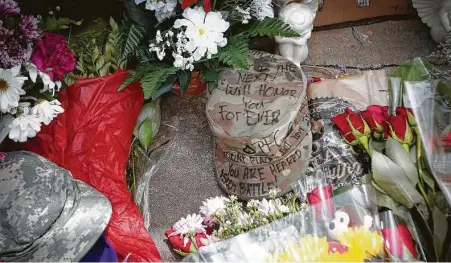  ?? Steve Gonzales / Staff photograph­er ?? People have left notes, stuffed animals, flags, flowers and notes at a makeshift memorial for deceased soldier Vanessa Guillén.