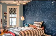  ?? Photo provided by Houzz.com ?? An accent wall can highlight a child’s personal interests and help him or her connect to the design of the space.