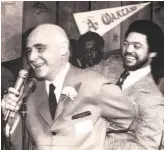  ?? The Chronicle ?? A’s owner Charlie Finley, shown with Reggie Jackson, made MC Hammer a teenage VP.