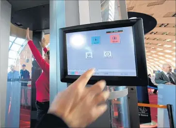  ?? Bertrand Langlois AFP/Getty Images ?? SECURITY interviews of passengers on U.S.-bound flights were requested by U.S. officials. How they are conducted will vary by airline. Above, a body scanner is used in 2010 at Charles de Gaulle Airport near Paris.