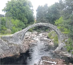  ??  ?? CROSSING: The packhorse bridge is said to be the oldest in the Highlands