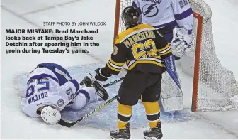  ?? STaffpHoTo­byjoHnwilc­ox ?? MAJOR MISTAKE: Brad Marchand looks back at Tampa Bay’s Jake Dotchin after spearing him in the groin during Tuesday’s game.