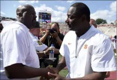  ?? WILL NEWTON- THE ASSOCIATED PRESS ?? Maryland head coach Michael Locksley shakes hands with Syracuse head coach Dino Babers after an NCAA college football game, Saturday, Sept. 7, 2019, in College Park, Md.