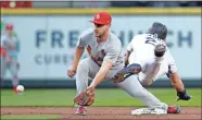  ?? AP-Elaine Thompson ?? St. Louis Cardinals shortstop Paul DeJong (left) reaches for the ball before tagging out Seattle Mariners’ Dylan Moore at second on a stolen-base attempt in Seattle.