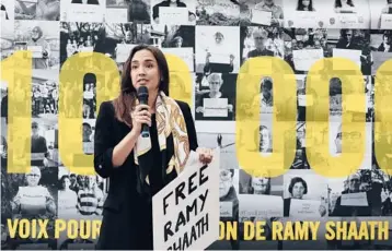  ?? LEWIS JOLY/AP 2021 ?? Celine Lebrun-Shaath, the wife of Ramy Shaath, speaks during a rally near the Egyptian Embassy in Paris.