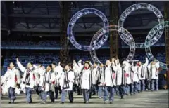  ?? ERIC FEFERBERG/AFP ?? South Korean and North Korean athletes march together during the opening ceremony of the 2006 Winter Olympics at the Olympic Stadium in Turin.