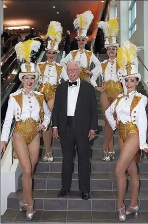  ??  ?? Percy Malone of Arkadelphi­a with Rockettes-style dancers
