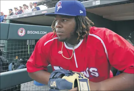  ?? JEFFREY T. BARNES - ASSOCIATED PRESS ?? In this July 31, 2018, file photo, Toronto Blue Jays top prospect third baseman Vladimir Guerrero Jr. looks on before a minor league baseball with the Buffalo Bisons against the Lehigh Valley IronPigs in Buffalo, N.Y. The displaced Toronto Blue Jays will play in Buffalo, New York, this year amid the pandemic. An official familiar with the matter told The Associated Press on Friday that the Blue Jays will play at Sahlen Field. The official spoke on condition of anonymity as they were not authorized to speak publicly ahead of an announceme­nt.