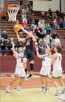  ?? Westside Eagle Observer photograph­s by Randy Moll ?? Greydon Edwards of Pea Ridge goes under the basket for a layup during play against the Pioneers in Gentry on Feb. 5.