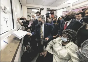  ?? AP PHOTO/VASHA HUNT ?? Claudette Colvin, seated, watches as her attorney Gar Blume files paperwork in juvenile court to have her juvenile record expunged, on Tuesday in Montgomery, Ala.