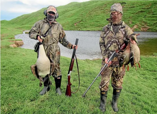  ??  ?? Cousins Lochy Mirfin, 13, left, and Jake Mirfin, 17, bagged mallard ducks and a Canada goose jump shooting small farm ponds in Golden Bay at Queen’s Birthday weekend. Camo face masks are essential for stalking close.