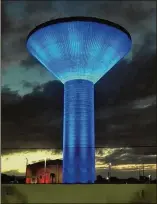  ?? CONTRIBUTE­D ?? Boynton Beach’s water tower, lit in blue and white through Wednesday for Hanukkah, will be lit again in Christmas colors until Dec. 26, when it will be lit for Kwanzaa.