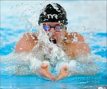  ?? Peter Diana/Post-Gazette ?? Upper St Clair’s Josh Matheny set a WPIAL record in the 100-yard breaststro­ke Sunday.
Upper St. Clair’s Taylor Connors made WPIAL history when she won the 200-yard freestyle title in her home pool.