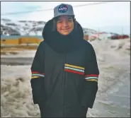  ?? (Courtesy Photo/Aaron Watson) ?? Owen Watson, 12, stands for a portrait in Iqaluit, the capital of Nunavut territory in far north Canada. Though there are no known cases of coronaviru­s in his town, Owen’s school has closed as a precaution. He thinks it’s only a matter of time before the virus arrives there. Iqaluit has a population of about 7,000 people, many of whom are Inuit.