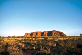  ?? LUKAS COCH / EPA ?? Uluru, also known as Ayers Rock, is seen just before sunrise at Uluru-Kata Tjuta National Park in the Northern Territory, Australia, on Oct 26.