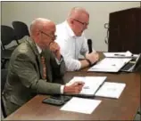  ?? RECORD FILE PHOTO ?? Troy Mayor Patrick Madden, left, watches as Deputy Comptrolle­r Andy Piotrowski addresses the Troy City Council’s Finance Committee during an Oct. 11meeting to discuss Madden’s proposed 2018 city budget.