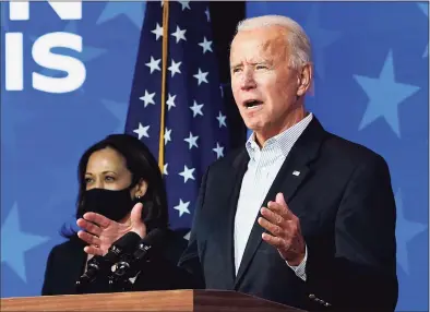  ?? Drew Angerer / TNS ?? President- elect Joe Biden speaks while flanked by Vice President- elect Kamala Harris at The Queen theater on Thursday in Wilmington, Del.