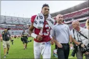  ?? VASHA HUNT — THE ASSOCIATED PRESS ?? Alabama quarterbac­k Tua Tagovailoa (13) jogs off the field after a victory over Mississipp­i in an NCAA college football game, Saturday in Tuscaloosa, Ala.