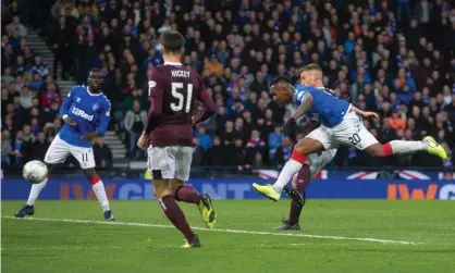  ??  ?? Alfredo Morelos (right) scores his second, and Rangers’ third, goal against Hearts. Photograph:Jeff Holmes/PA