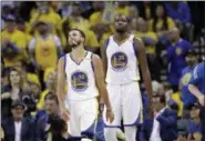 ?? MARCIO JOSE SANCHEZ — THE ASSOCIATED PRESS ?? Golden State Warriors’ Stephen Curry (30) and Kevin Durant during the second half of Game 2 of the NBA basketball Western Conference finals against the San Antonio Spurs, Tuesday in Oakland