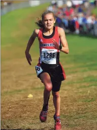  ?? Christian Abraham / Hearst Connecticu­t Media ?? Pomperaug’s Kate Wiser crosses the finish line for a course record during the Class L cross country championsh­ips on Oct. 26.