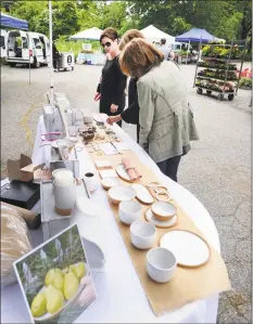  ?? File / Bob Luckey Jr. / Hearst Connecticu­t Media ?? Customers shop at the Old Greenwich Farmers Market at the Living Hope Church in Old Greenwich. The market is open from 2:30 to 6 p.m. Wednesdays through October.