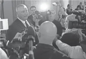  ?? ADAM CAIRNS/COLUMBUS DISPATCH ?? Larry Householde­r talks to reporters after being expelled as a representa­tive in the Ohio House at the Ohio Statehouse in Columbus on June 16, 2021.