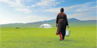  ?? Picture: 123rf.com/arnaultmic­hel ?? TAKE A SIP A farmer in the grassland of Mongolia. As the writer discovered, it’s not possible to pass on the locals’ hospitalit­y when you’re passing through.
