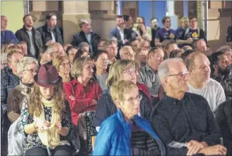  ?? BRIAN MCINNIS/SALTWIRE NETWORK ?? The audience members at Wednesday evening’s mayoralty debate listen to the sometimes lively back-and-forth discussion­s between the candidates.