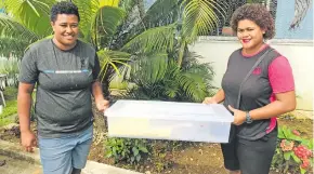  ?? Photos: Fonua Talei ?? Talei Banuve with Serafina Masiola with their container of pastries in Suva on April 2, 2021.