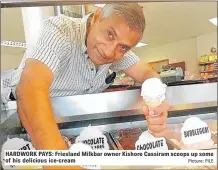  ?? Picture: FILE ?? HARDWORK PAYS: Friesland Milkbar owner Kishore Cassiram scoops up some of his delicious ice-cream