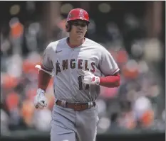  ?? AP PHOTO/JESS RAPFOGEL ?? Los Angeles Angels designated hitter Shohei Ohtani runs the bases after hitting a home run against the Baltimore Orioles during the first inning of a baseball game at Oriole Park at Camden Yards on Thursday in Baltimore.