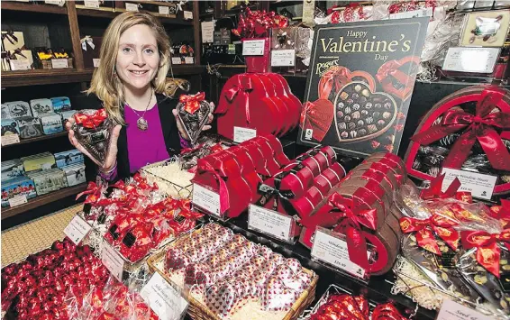  ?? DARREN STONE, TIMES COLONIST ?? UVic assistant professor of geography Sophia Carodenuto, who has been studying cocoa farming and fair trade in West Africa, at Rogers’ Chocolates in Victoria.