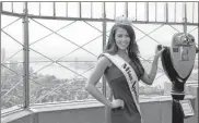  ?? / AP-Mary Altaffer, File ?? Miss America 2018 Cara Mund poses for photograph­ers on the 86th Floor Observatio­n Deck of the Empire State Building in New York.