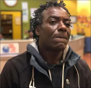  ??  ?? sean kayode, outside the next Door homeless shelter in san francisco, is suing the city—saying he lost his means of food-delivery employment and his home when his car was impounded in March for having too many parking tickets.